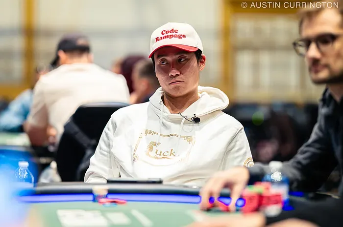 Rampage Poker Tournament Table Ethan Rampage Yau at a tournament table wearing a Rampage-branded cap