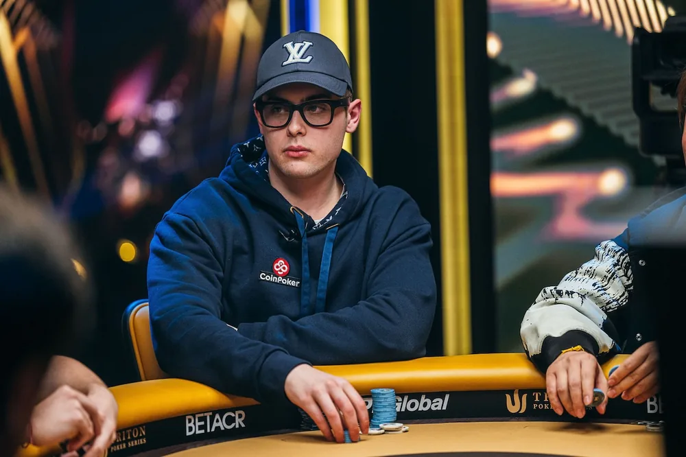 Frankie Cucchiara in a CoinPoker hoodie at a Triton Poker table