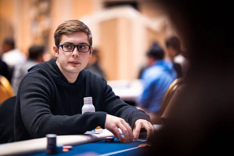 Frankie Cucchiara studying the board at a live tournament table
