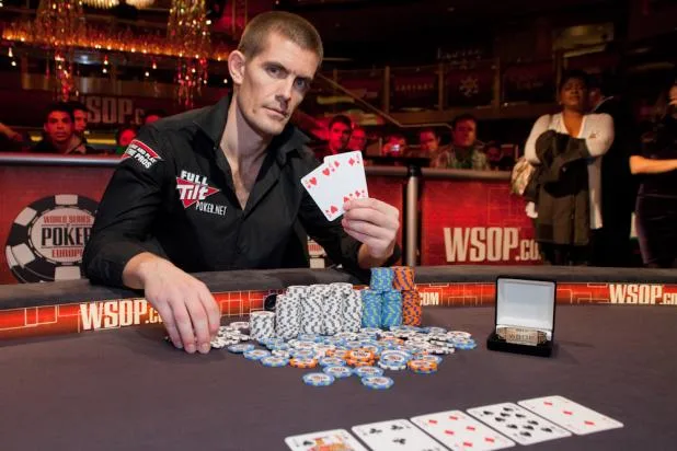 Gus Hansen WSOP Europe 2010 bracelet Gus Hansen with his 2010 WSOP Europe bracelet and the winning cards