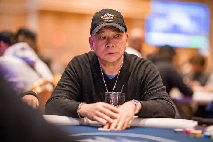 Johnny Chan poker career earnings Johnny Chan at the poker table in a Hard Rock cap