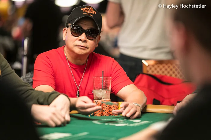 Johnny Chan WSOP cash games and television Johnny Chan in sunglasses stacking chips at the WSOP