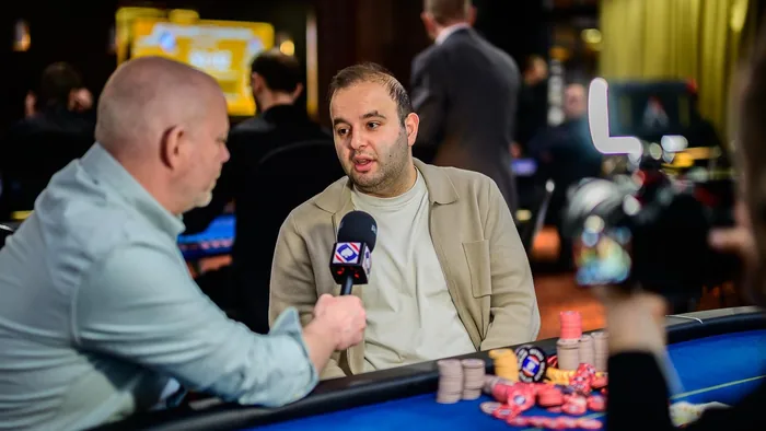 Kayhan Mokri interview Kayhan Mokri giving an interview at the poker table