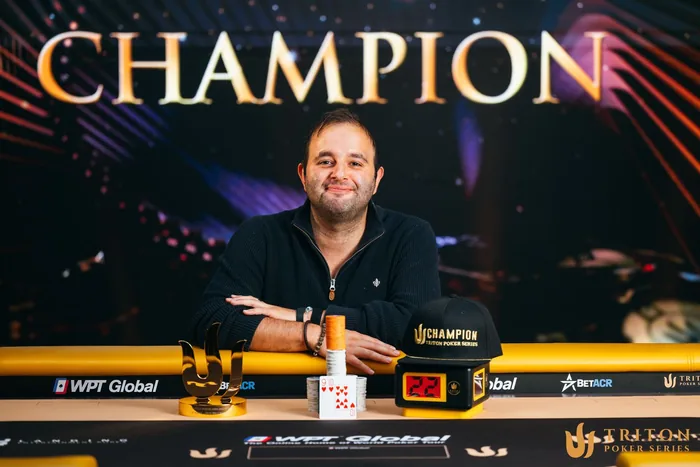 Kayhan Mokri Triton Jeju champion Kayhan Mokri with the Triton trophy and champion cap after winning in Jeju
