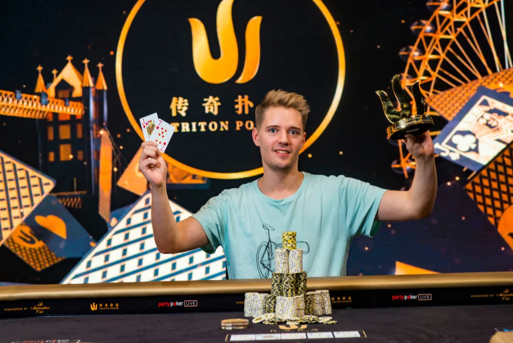 Linus Loeliger Triton London Title Linus Loeliger holding the Triton trophy and his winning jack-seven after the 2019 London title