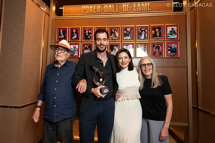 Nick Schulman Poker Hall of Fame induction 2025 Nick Schulman holding the Poker Hall of Fame trophy with his family at the 2025 induction