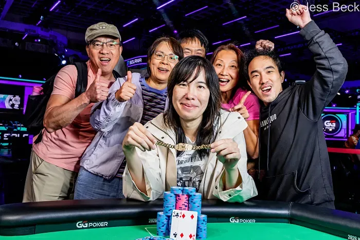 Skye Chen Celebrates With Her Rail Skye Chen holding her WSOP bracelet with her supporters after winning the 2026 Ladies Championship