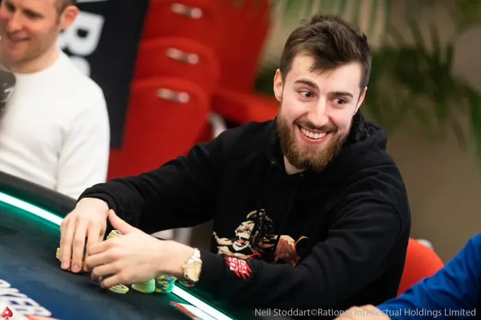 Wiktor Malinowski at a PokerStars Live Table Wiktor Malinowski smiling at a PokerStars live tournament table
