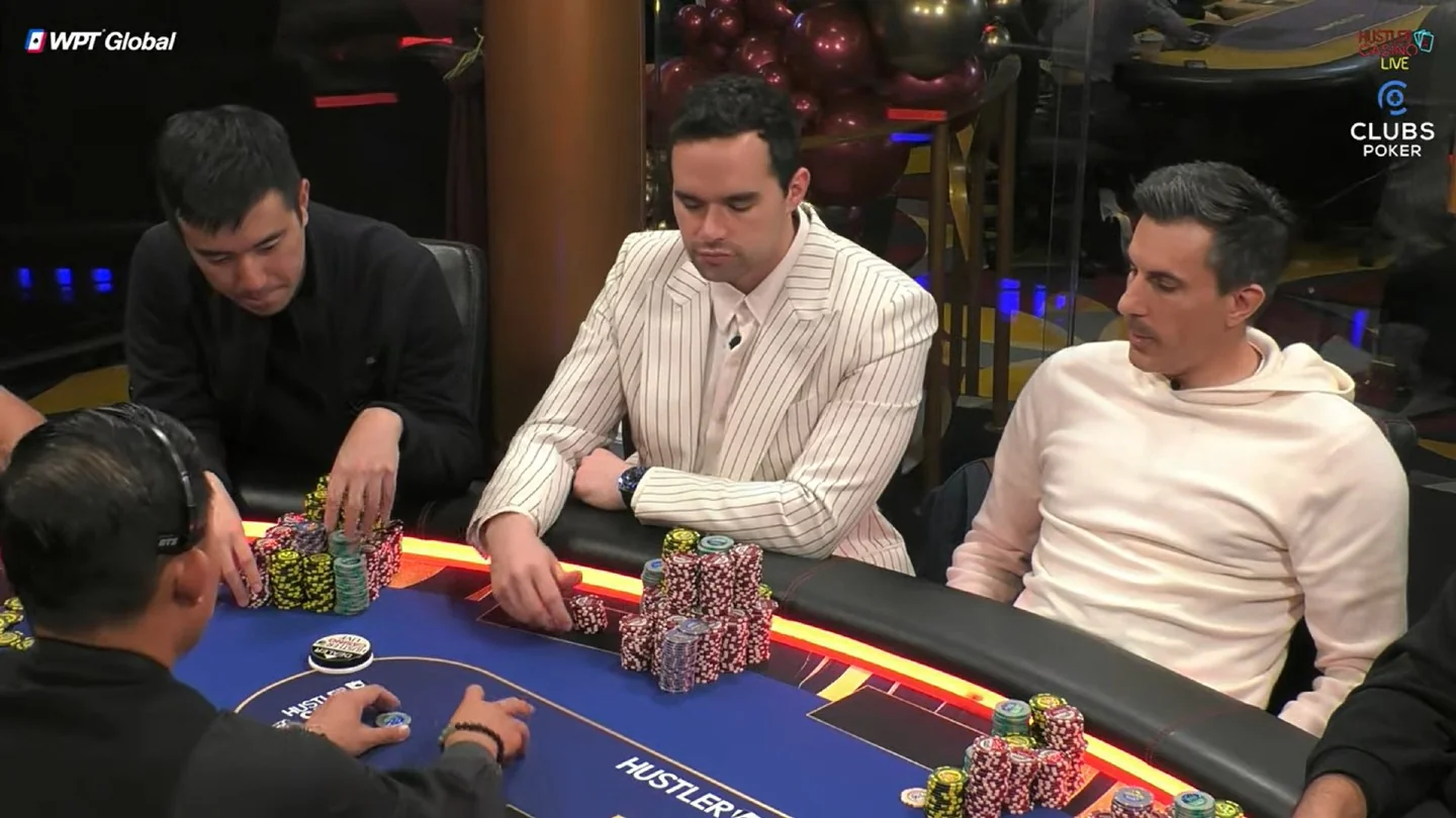 Alan Keating in a striped suit playing a Hustler Casino Live Million Dollar Game session