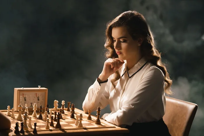 Alexandra Botez studying a chess position during a competitive match