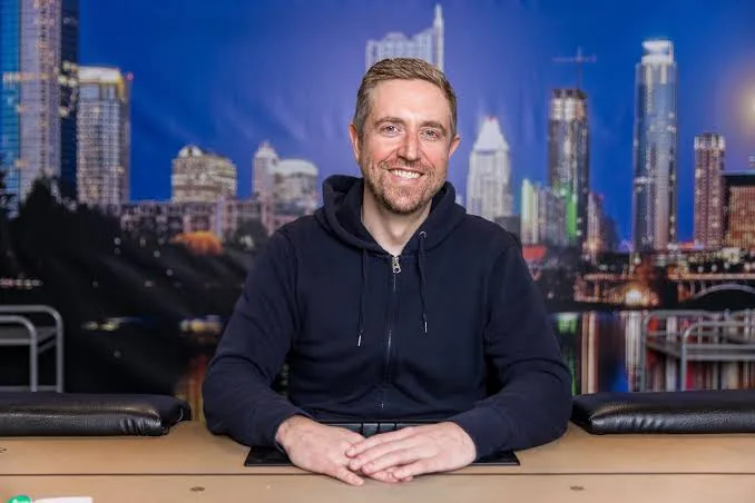 Andrew Neeme on the Lodge Card Club livestream set with the Austin skyline backdrop