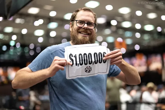 Andrew Shelton holds the $1,000,000 mystery bounty placard at the 2026 WSOP Mini Mystery Millions