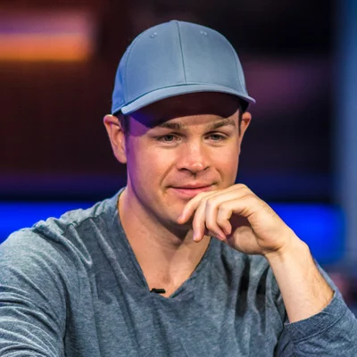 Andrew Robl wearing a blue cap at the PokerGO studio during a high-stakes cash game session