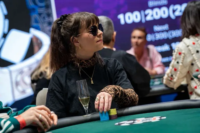 Annette Obrestad on the tournament floor Annette Obrestad seated at a live poker tournament table