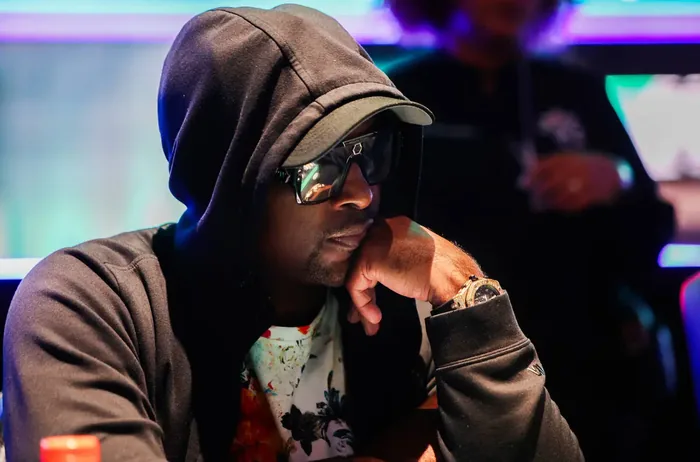 Antoine Winfield Sr. in a hoodie and sunglasses at the tables during the WSOP 2026 Main Event