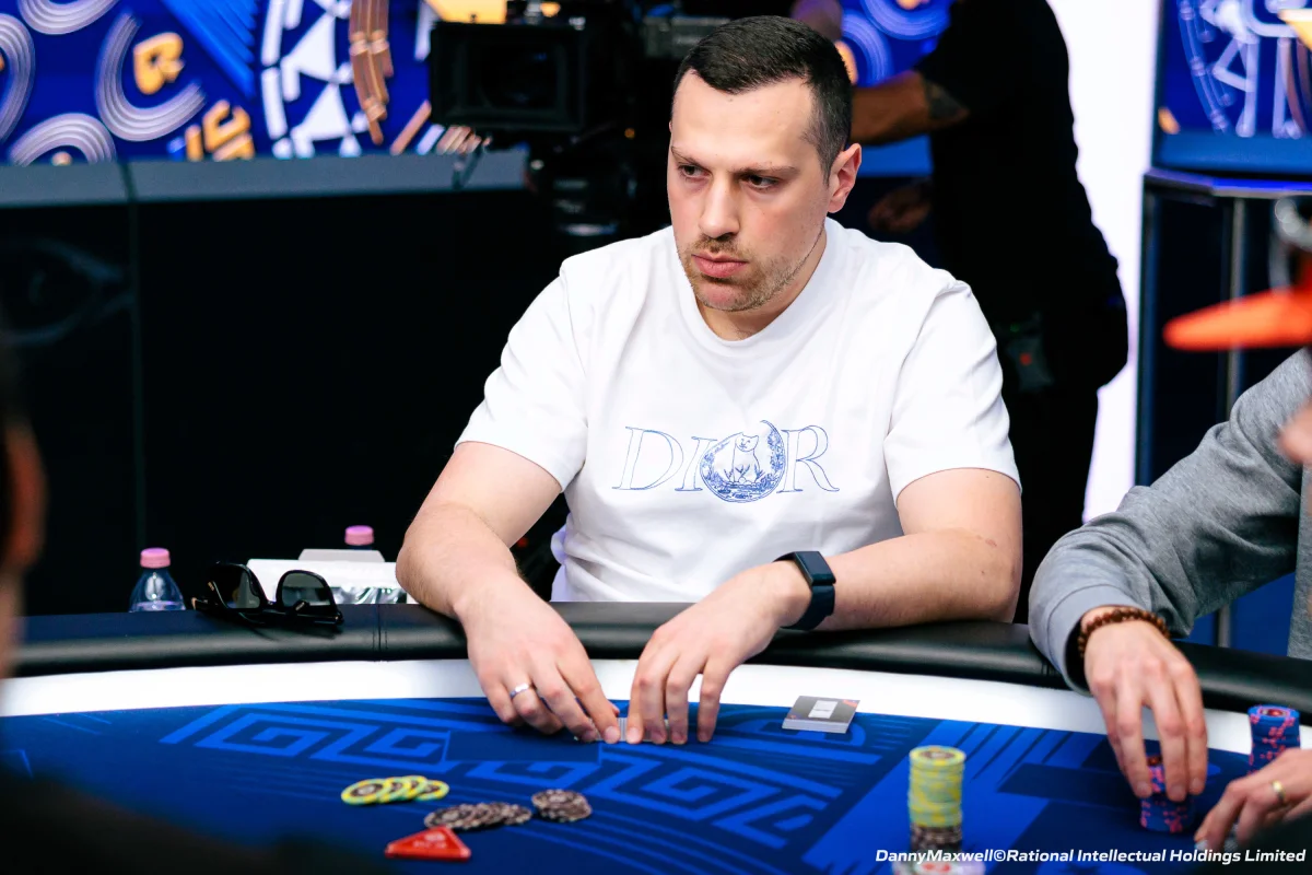 Artur Martirosian at a European Poker Tour table Artur Martirosian in a white Dior shirt at a European Poker Tour final table