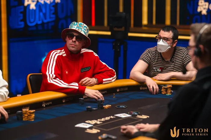 Manuel Fritz in red Adidas tracksuit at the Triton ONE Jeju 2026 $15K High Roller final table