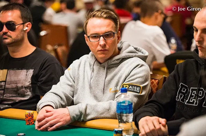 Benjamin Bencb Rolle at the WSOP Benjamin Rolle seated at a WSOP table wearing a Raise Your Edge hoodie