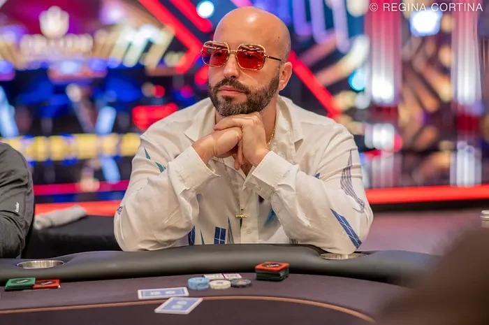 Bryn Kenney seated at a super high roller table