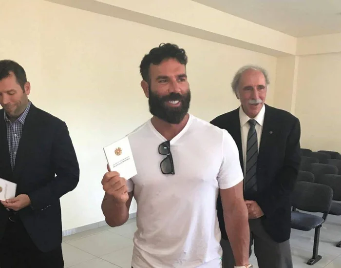 Dan Bilzerian holding his Armenian passport alongside his father Paul Bilzerian in 2018
