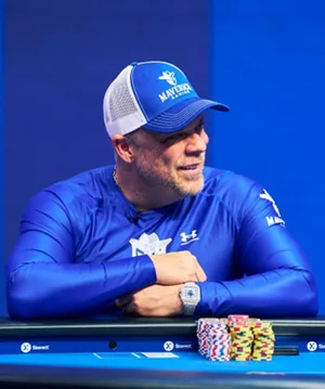 Eric Persson wearing Maverick Gaming gear at a high-stakes poker table