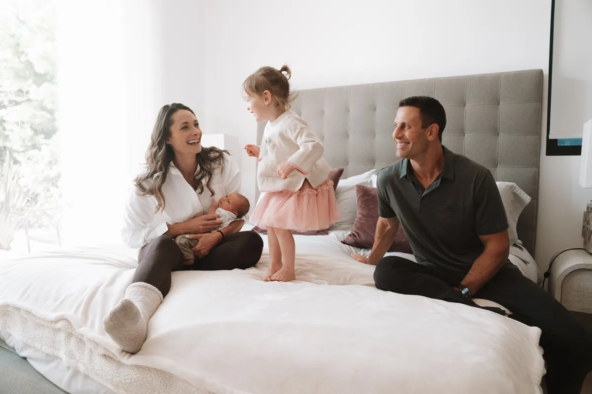 Garrett Adelstein and family Garrett Adelstein at home with his wife and their two children