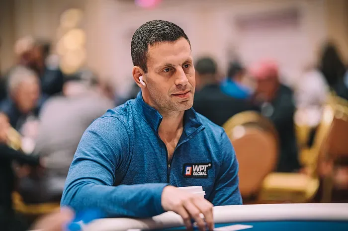 Garrett Adelstein at a poker tournament Garrett Adelstein in WPT Global gear at a live poker tournament