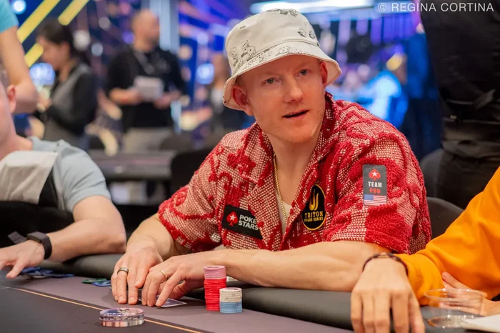 Jason Koon wearing PokerStars and Triton Poker patches at a super high roller event