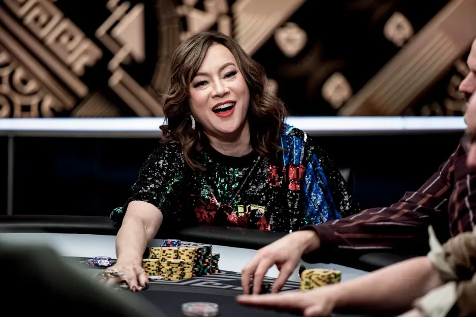 Jennifer Tilly reaching for chips during a televised high stakes cash game