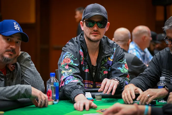 Joe Ingram at a Live Tournament Table Joe Ingram in sunglasses and a floral jacket at a live poker tournament table