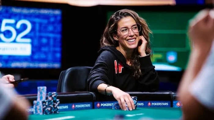 Leo Margets smiling at a poker table during a live tournament