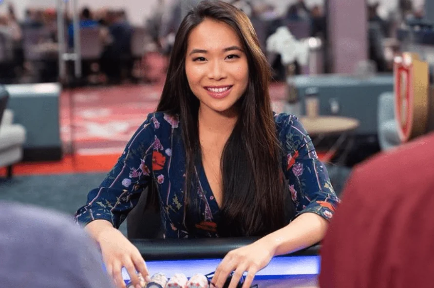 Lynne Ji at the Poker Table Lynne Ji seated at a poker table with chips in front of her