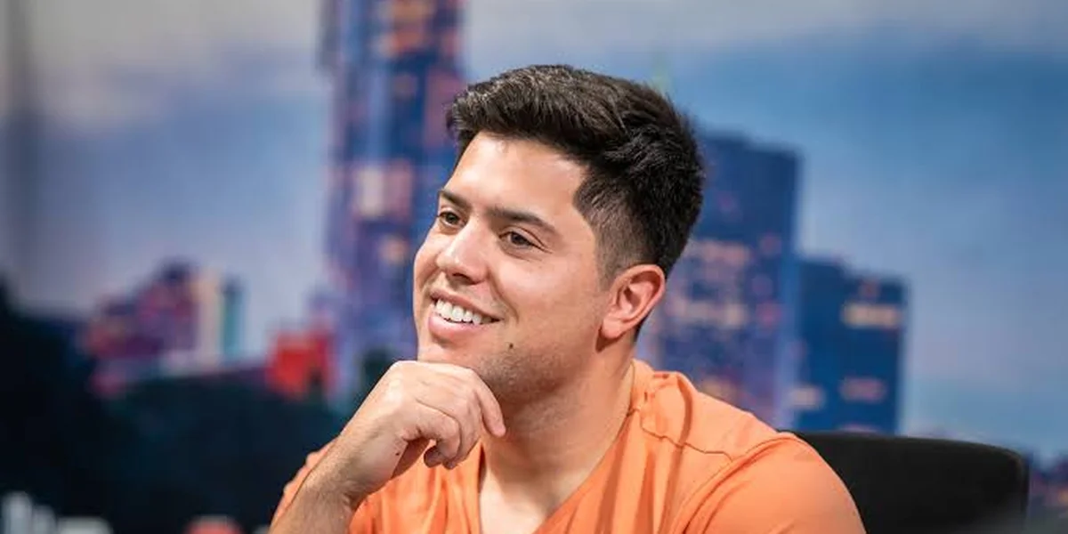 Mariano Grandoli poker vlogger interview Mariano Grandoli smiling during an interview, the poker vlogger who became a Hustler Casino Live headliner