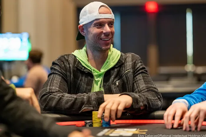 Matt Berkey smiling at the table during a live tournament