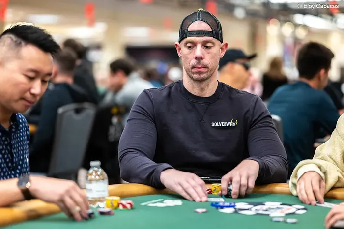 Matt Berkey wearing a Solve For Why shirt at the World Series of Poker