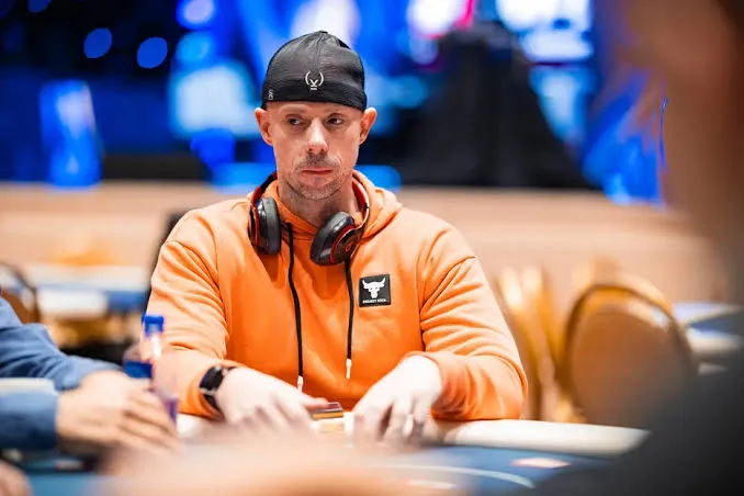 Matt Berkey in an orange hoodie during a World Series of Poker event