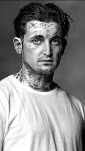 Mikki Mase black and white portrait showing facial tattoos