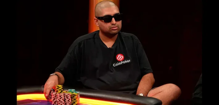 Nik Airball wearing a CoinPoker branded shirt at the poker table