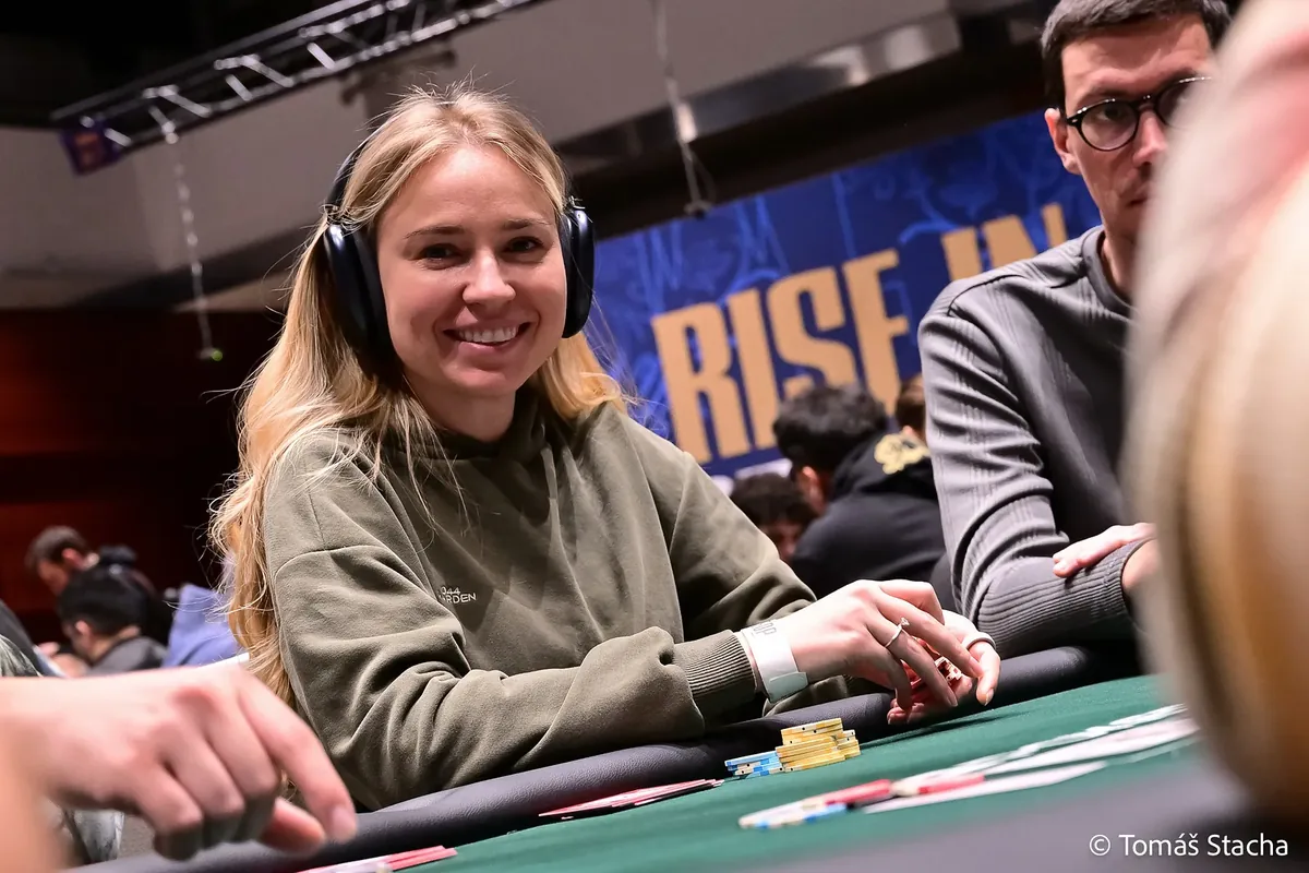 Olga Iermolcheva Televised Table Olga Iermolcheva smiling at a live tournament table wearing headphones