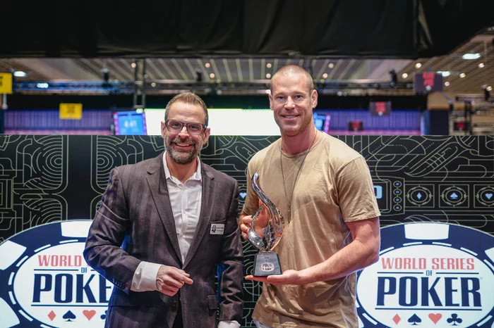 Patrik Antonius holding the Poker Hall of Fame trophy at the World Series of Poker