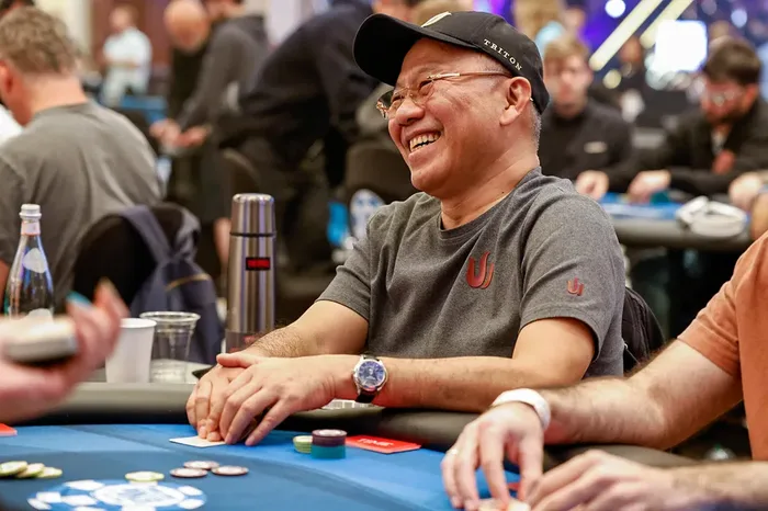 Paul Phua laughing at the poker table during a Triton Poker event