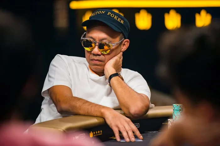 Paul Phua wearing Triton Poker cap and sunglasses at the poker table
