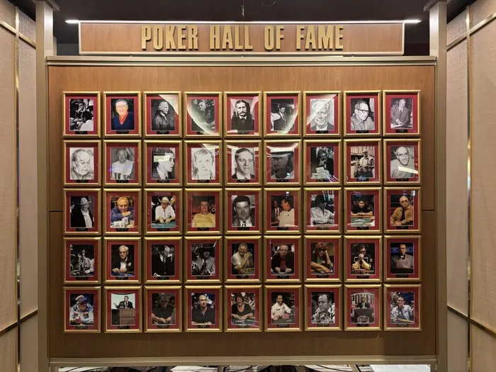 The Poker Hall of Fame wall displaying framed portraits of all inductees at the Horseshoe Las Vegas