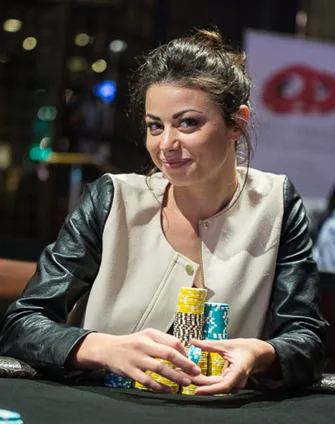 Samantha Abernathy at the poker table with tournament chips