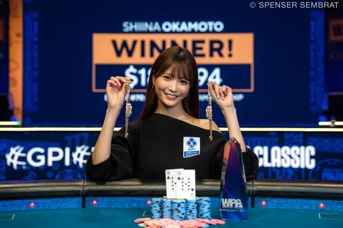 Shiina Okamoto holding two WSOP bracelets after winning the 2025 Ladies Championship