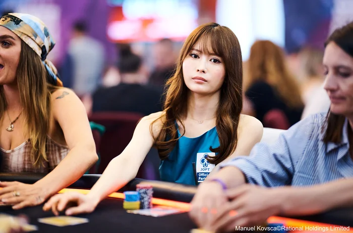 Shiina Okamoto focused at the poker table wearing her JOPT Official Partner patch
