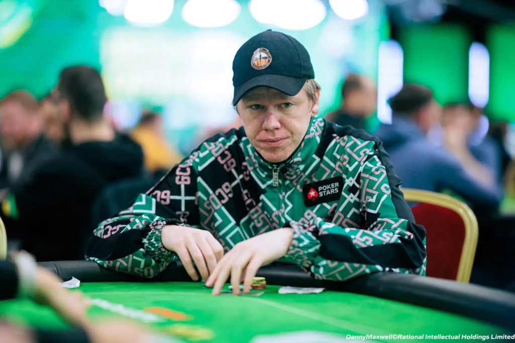 Spraggy Playing a PokerStars Live Event Spraggy checking his hole cards at a PokerStars live tournament table