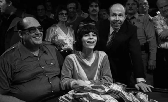 Stu Ungar celebrating a WSOP Main Event title Stu Ungar celebrating a WSOP Main Event title behind stacks of cash