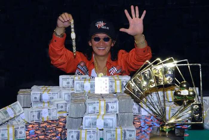 Scotty Nguyen celebrates winning the 1998 WSOP Main Event Scotty Nguyen holding his WSOP bracelet and surrounded by cash after winning the 1998 Main Event