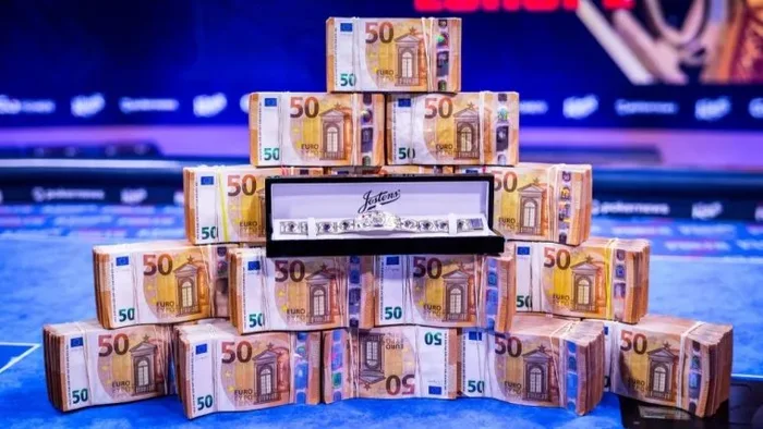 WSOP Europe bracelet and prize pool WSOP Europe gold bracelet displayed with stacked euro banknotes representing the record prize pool